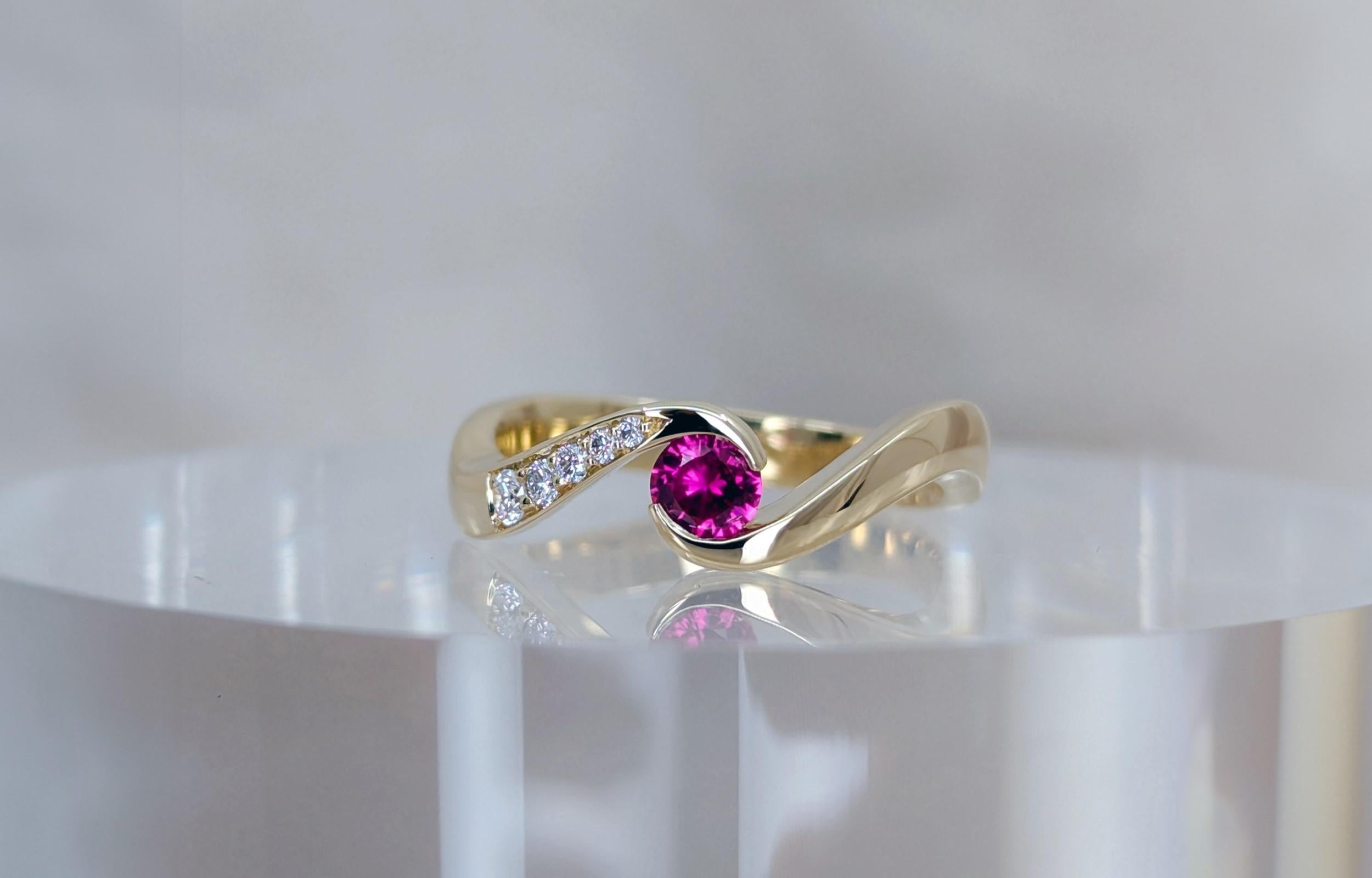 Ruby and diamond engagement ring with July's birthstone