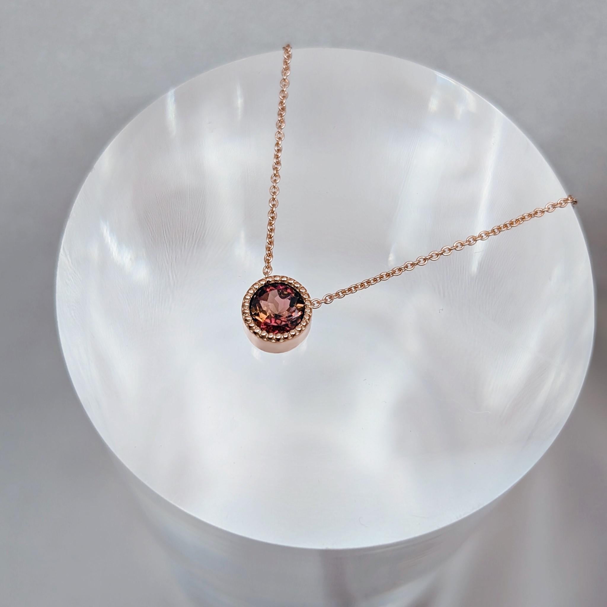 Autumn bicolour tourmaline gemstone displayed