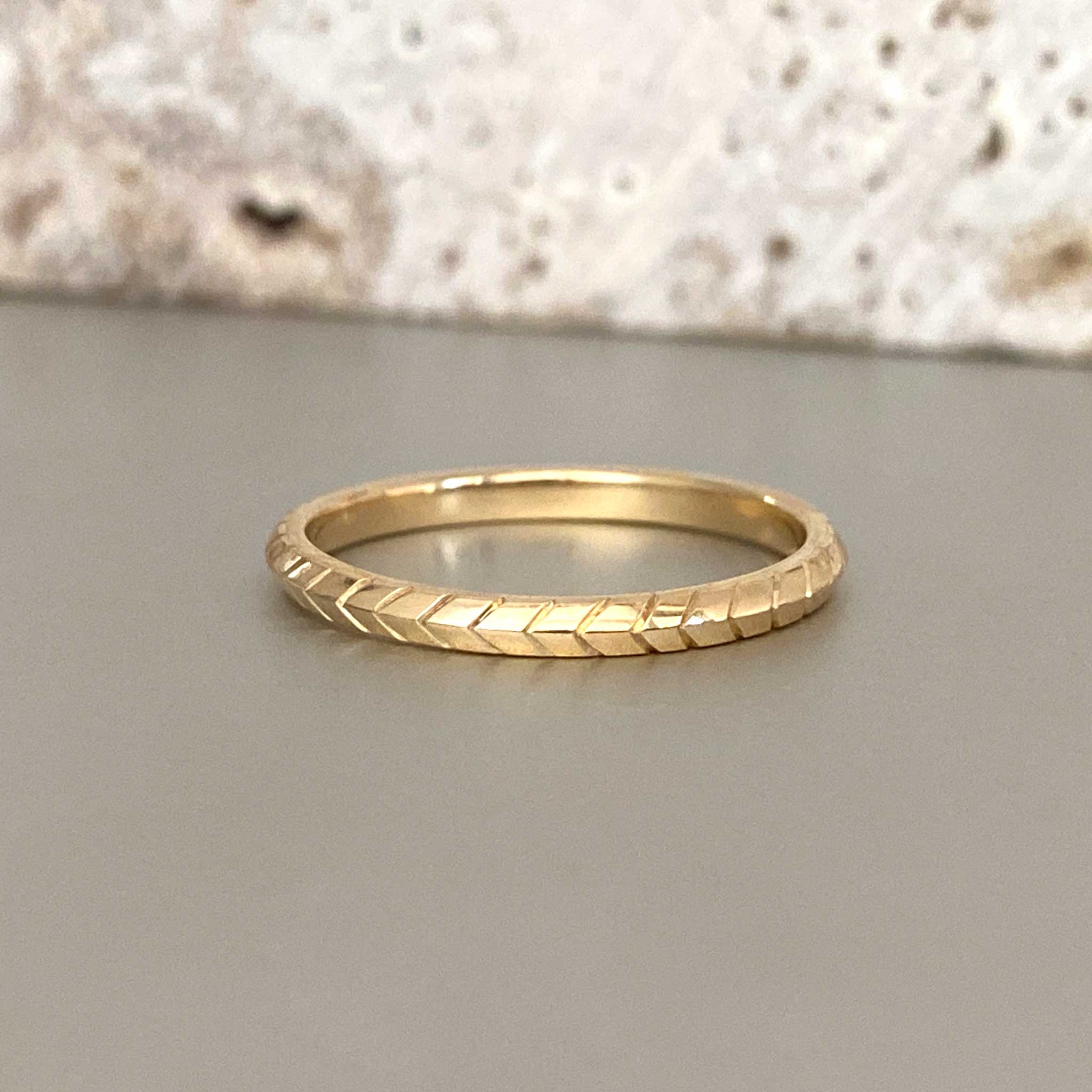 Hand engraved chevron pattern gold wedding ring