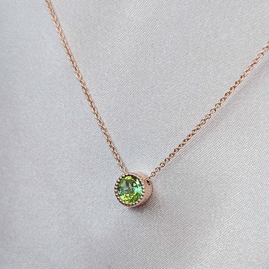 Lime green tourmaline in a rose gold milgrain pendant