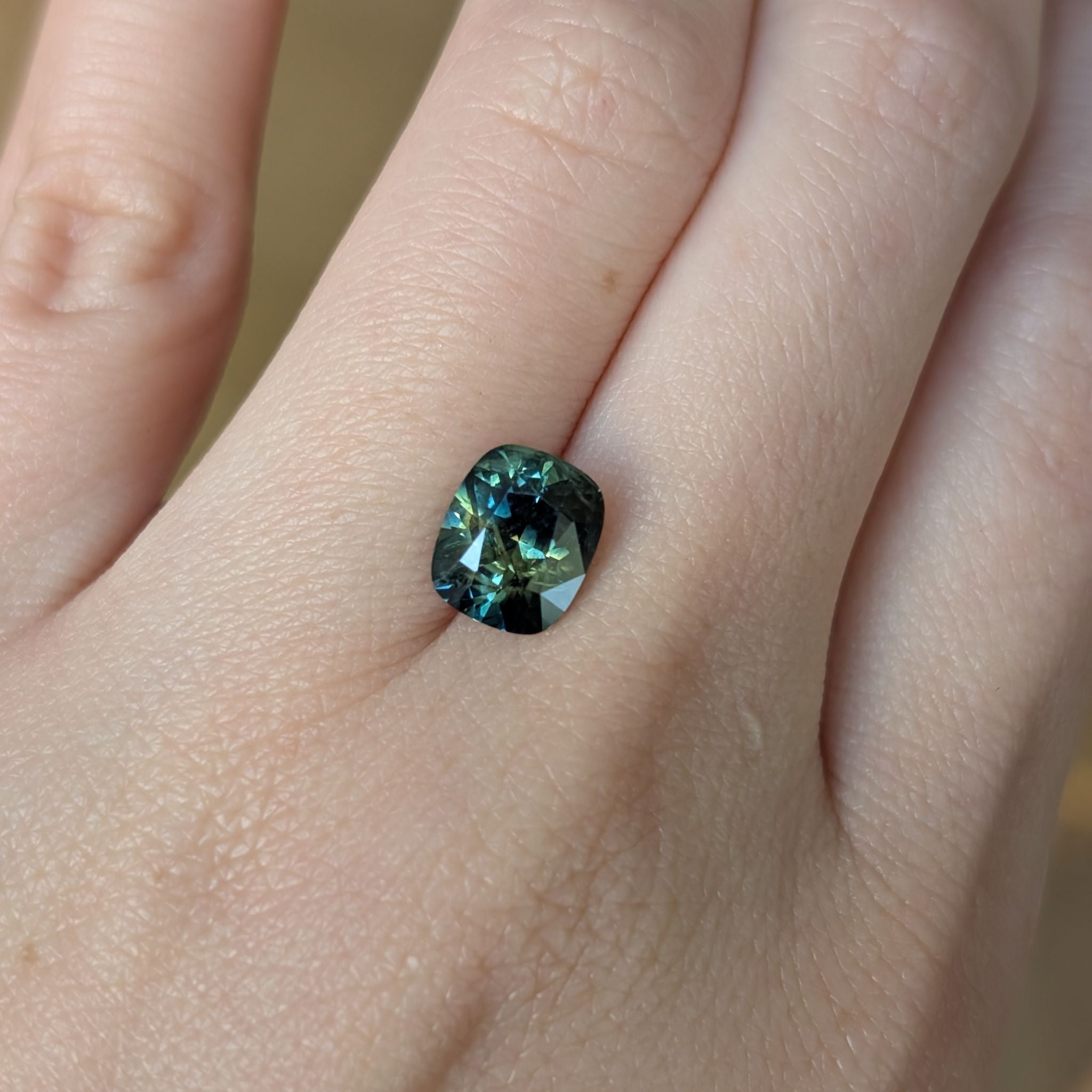 Gemstone against hand for scale – 2.9ct Australian sapphire showing size and proportions