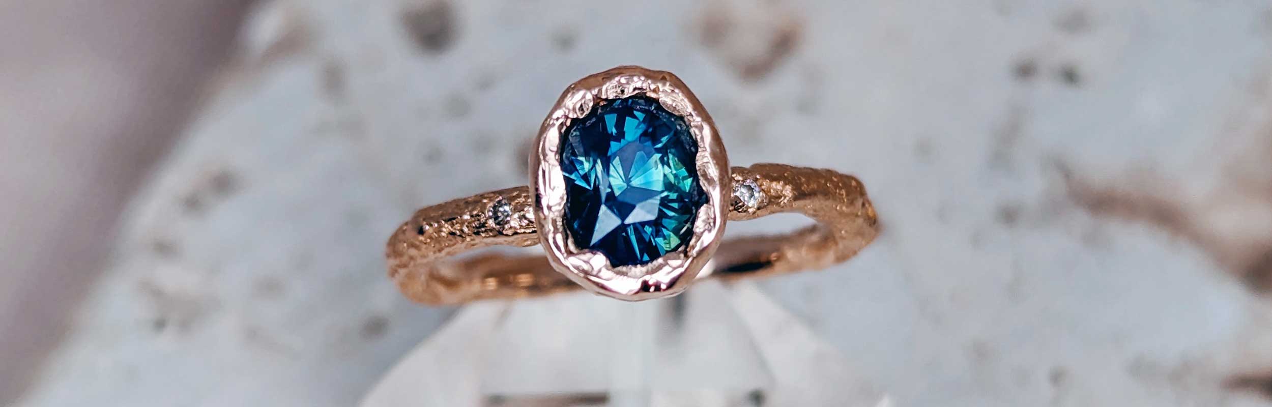 Opalescent Montana sapphire rustic engagement ring by Fairina Cheng