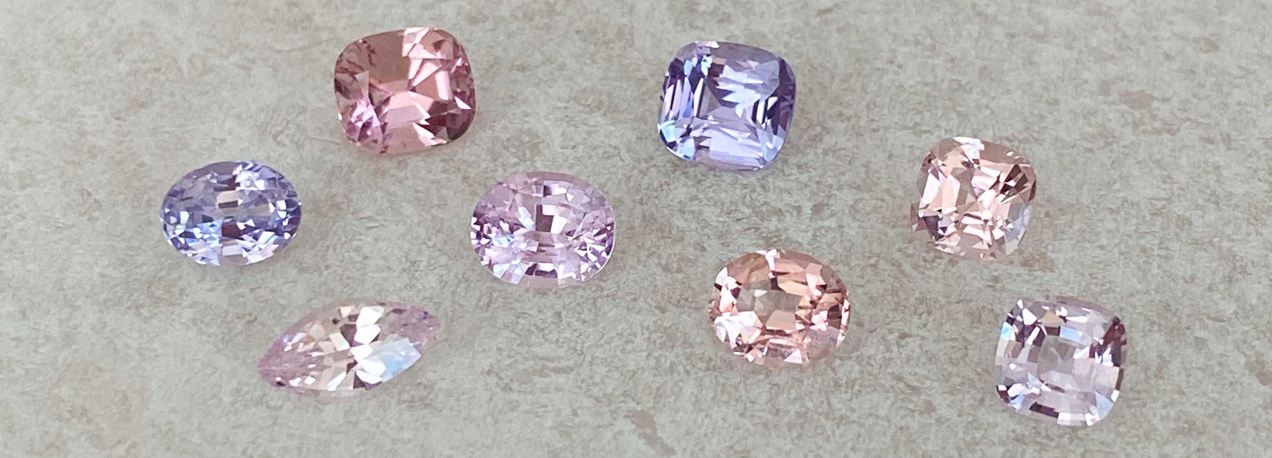 Pastel lilac pink and peach tourmalines and sapphires