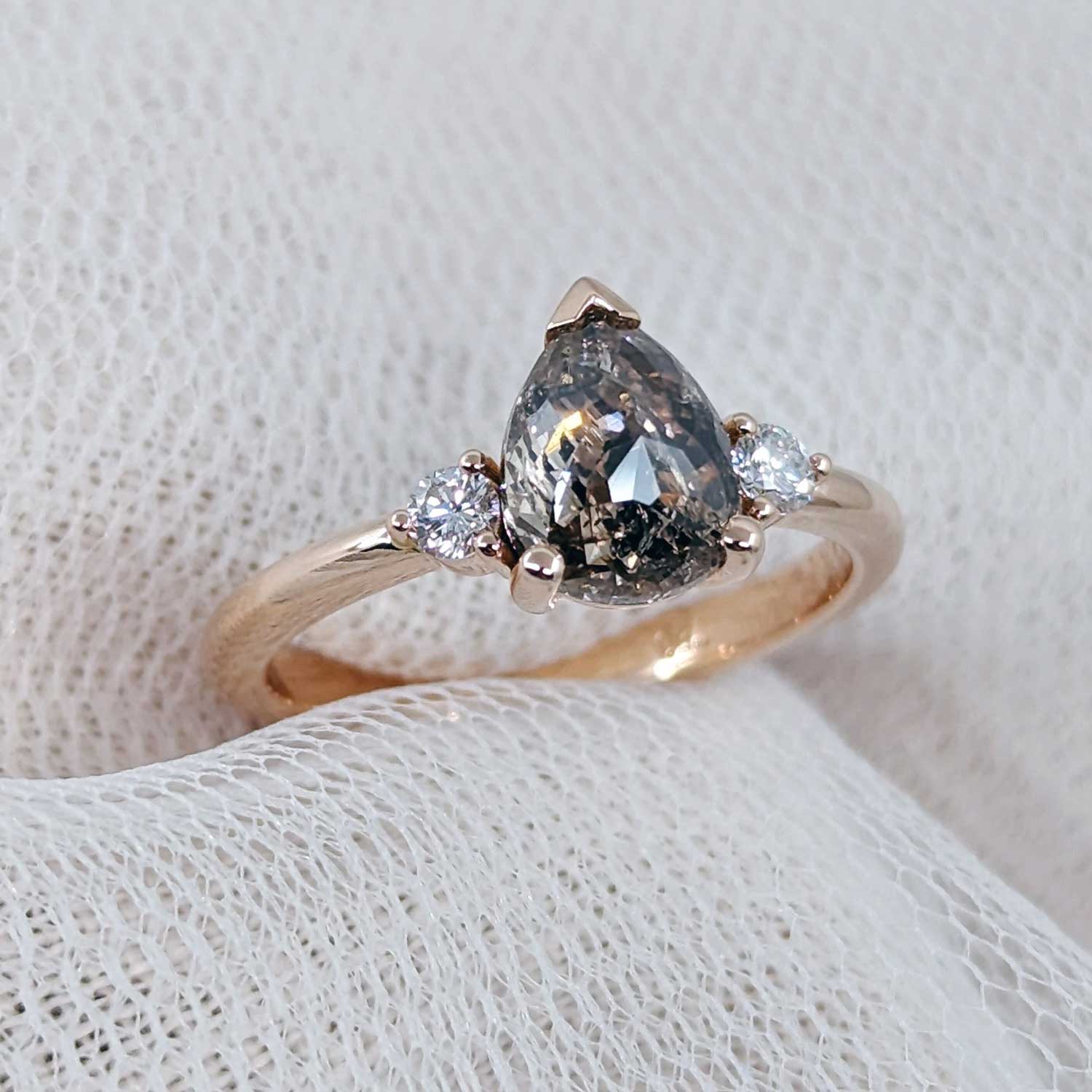 Engagement rings: 2 ct diamond in a pear salt and pepper diamond trilogy design