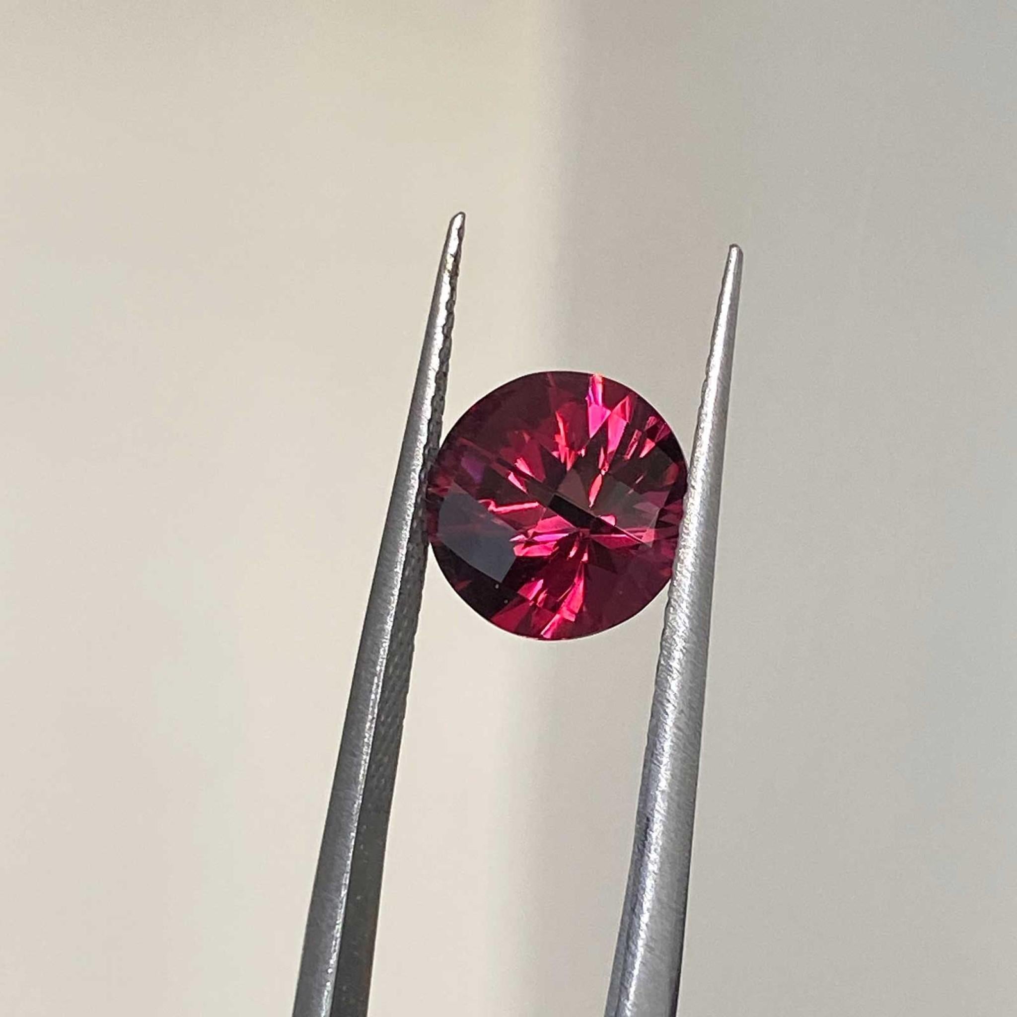 Round checkboard cut rhodolite garnet gemstone