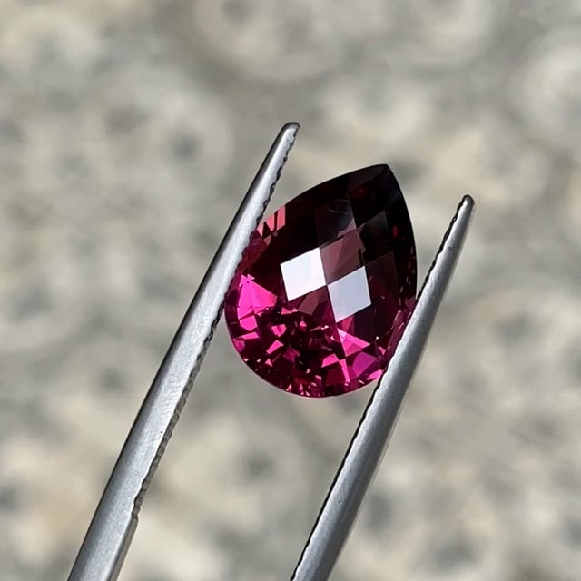Checkerboard cut garnet in burgundy