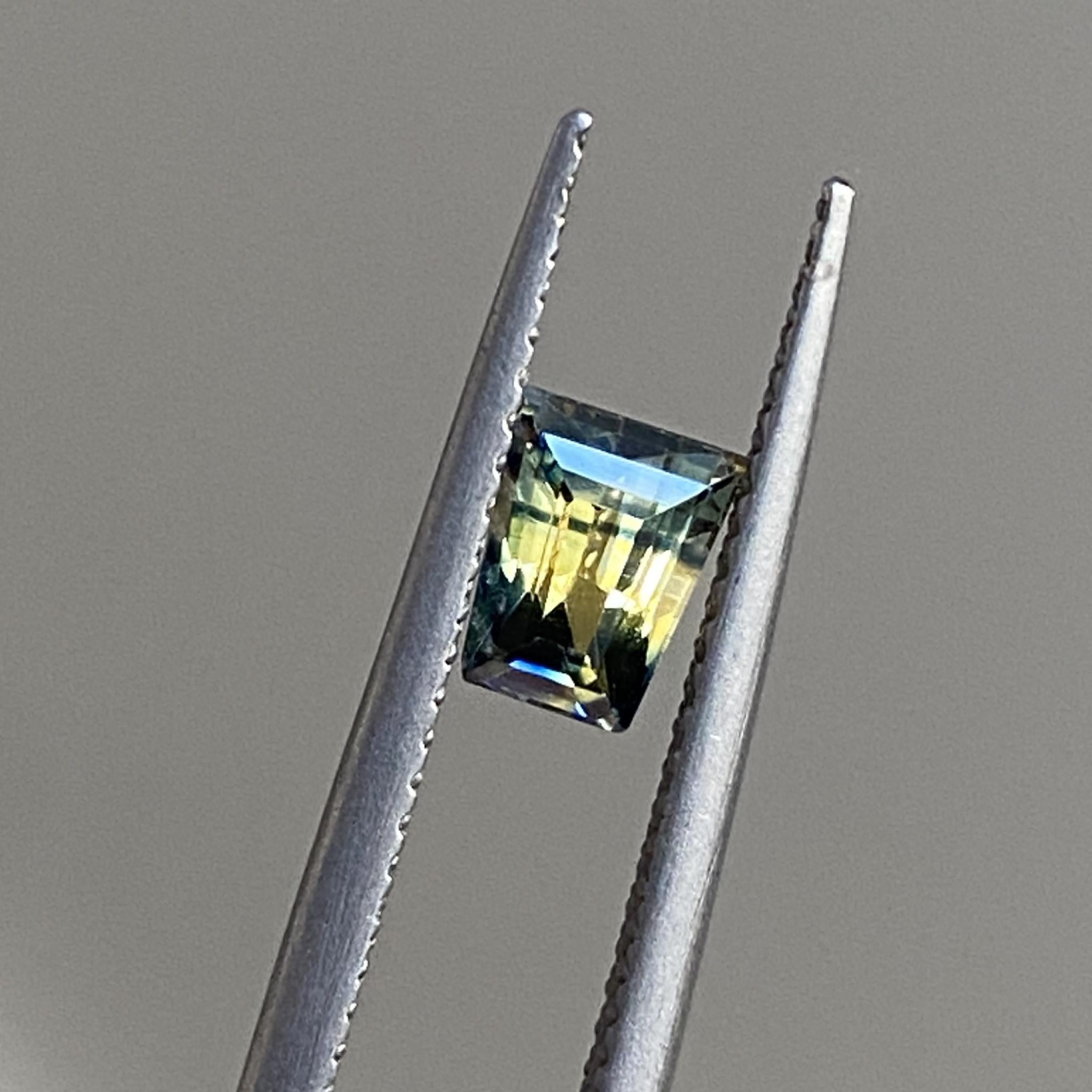 Close-up of Equinox sapphire’s sharp tapered baguette cut and colour transition.