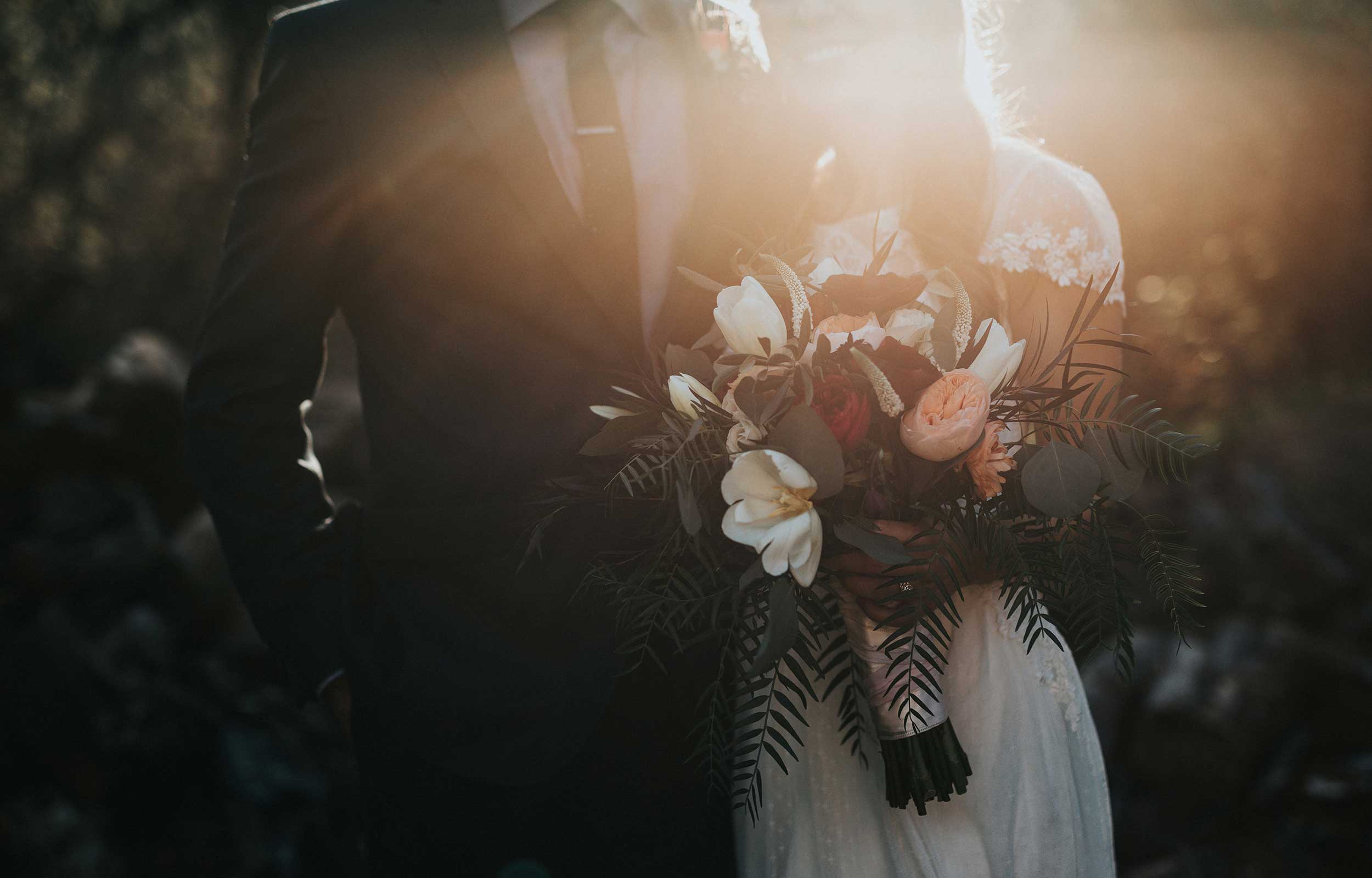 Wedding photo of a couple holding a bouquet