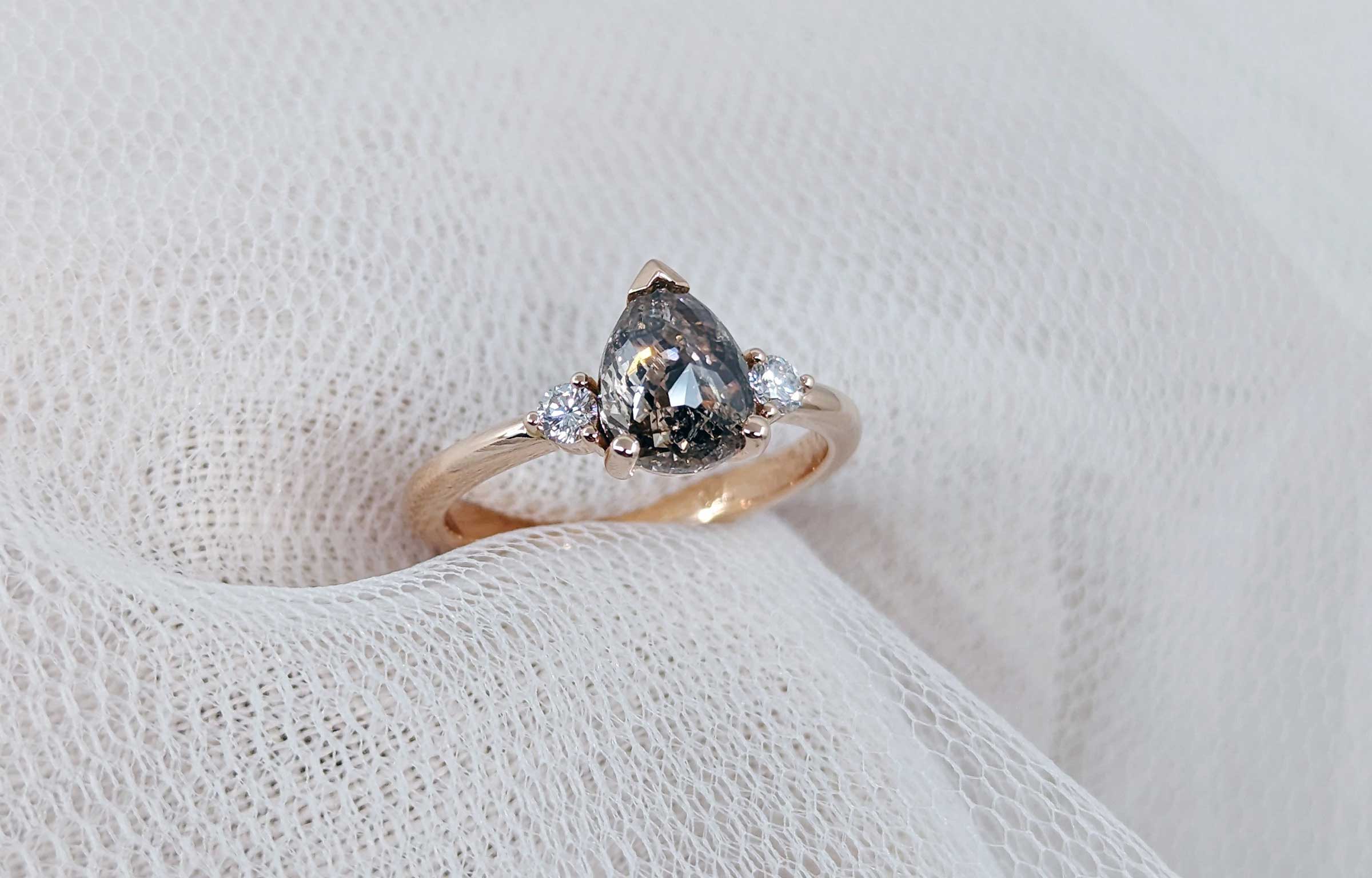 Unique engagement ring in salt and pepper diamond and rose gold