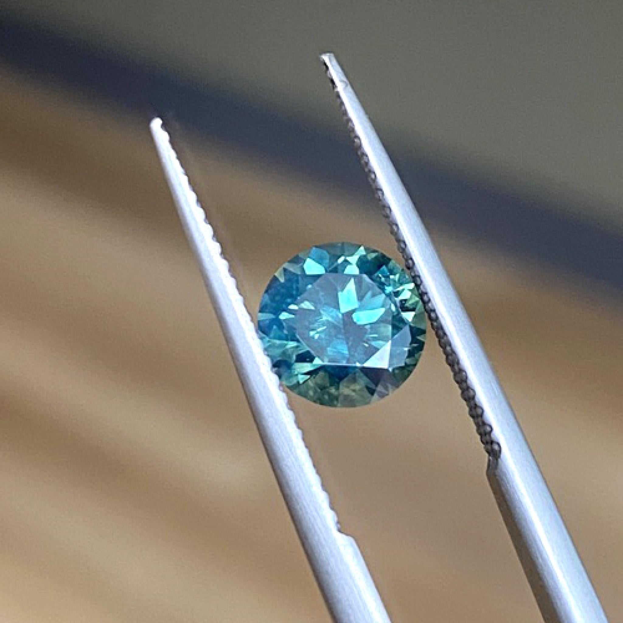 Australian teal sapphire displayed