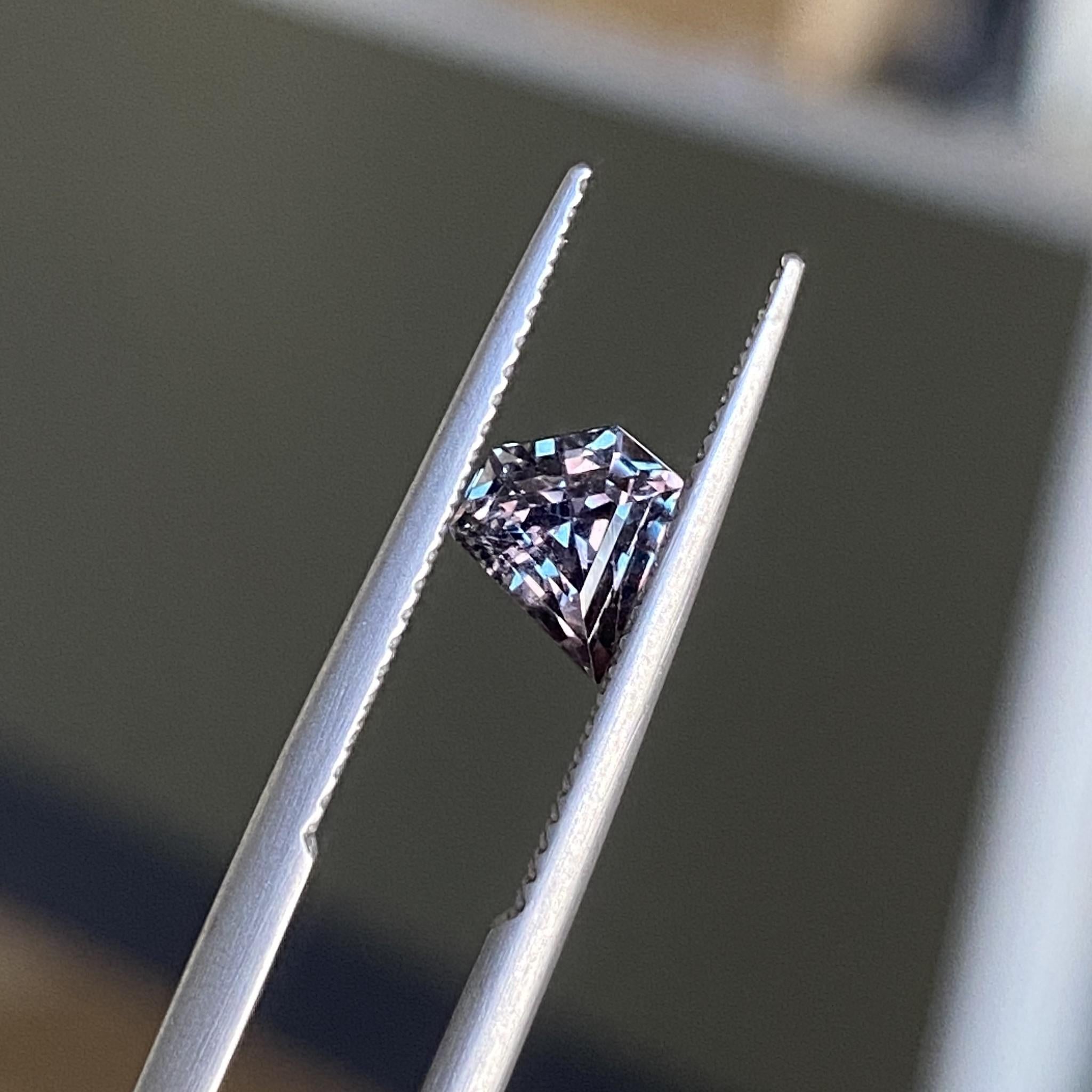 Close-up of Duality colour-change sapphire detailing its unique shield cut