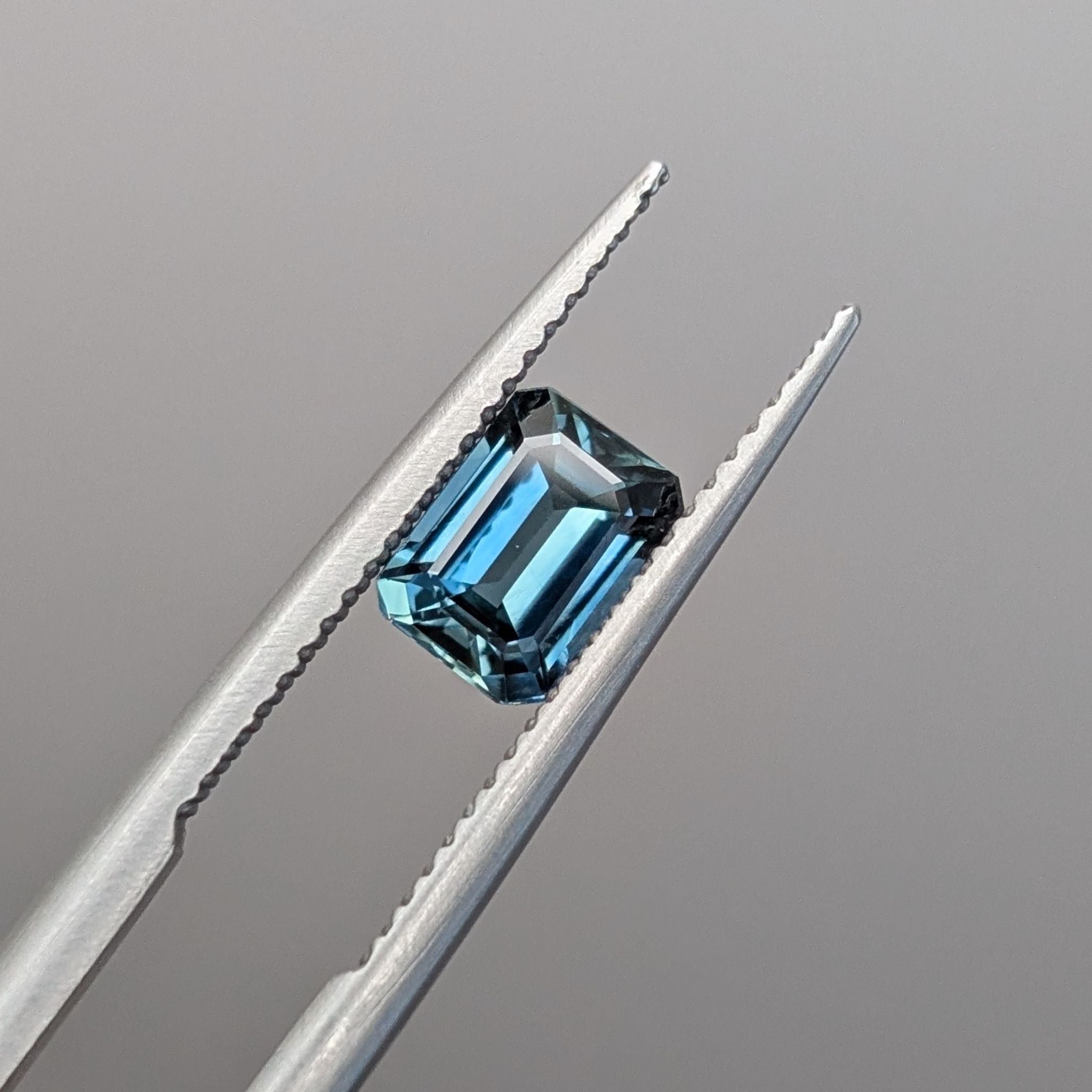 a blue moody emerald cut sapphire