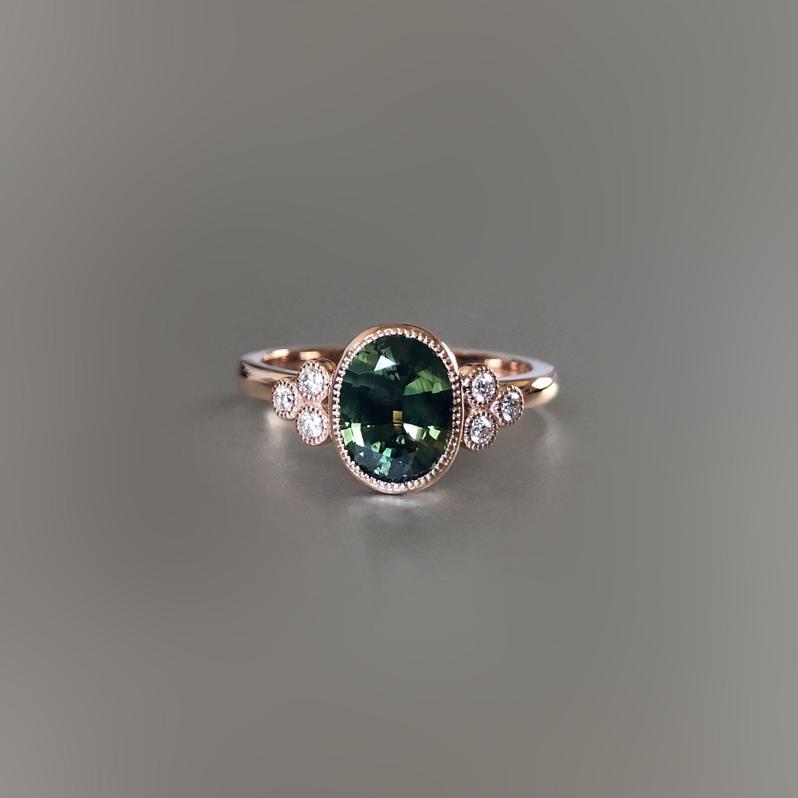 Green sapphire and diamond ring