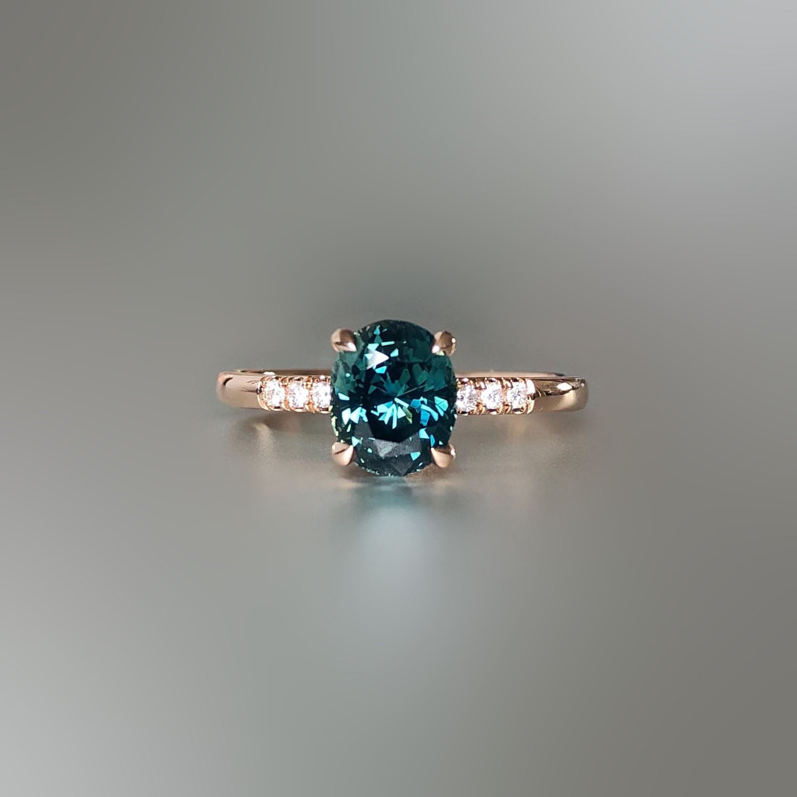 Green teal sapphire and rose gold diamond ring