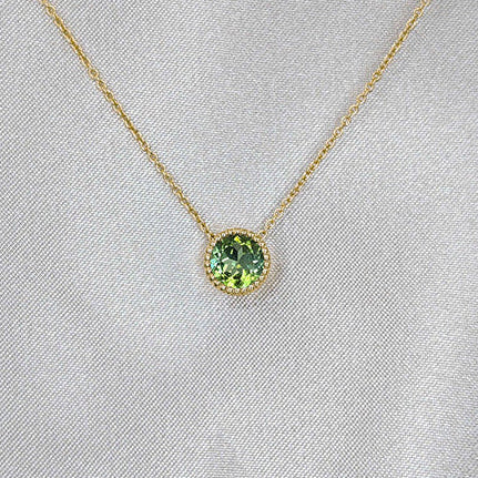 Yellow gold seafoam tourmaline pendant by Fairina Cheng