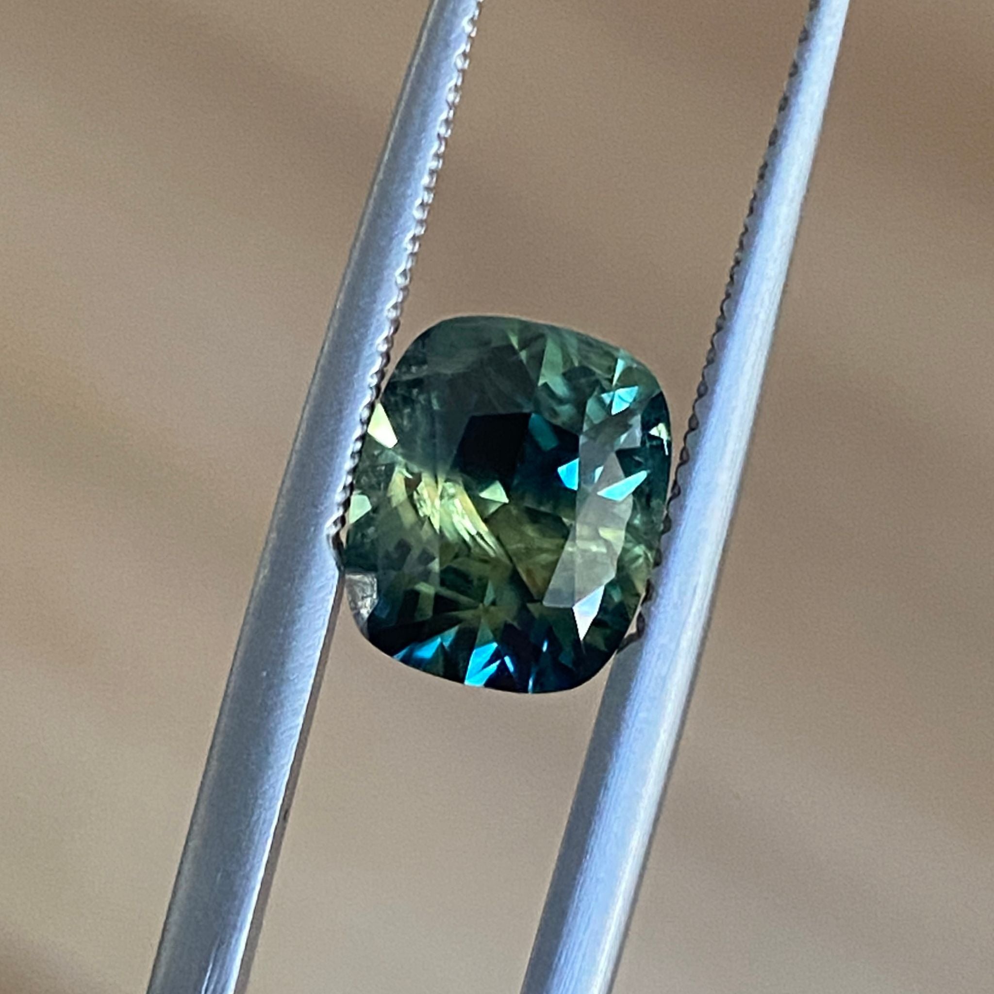 8.8 x 7.4mm parti sapphie with crisp faceting and bold colour zoning