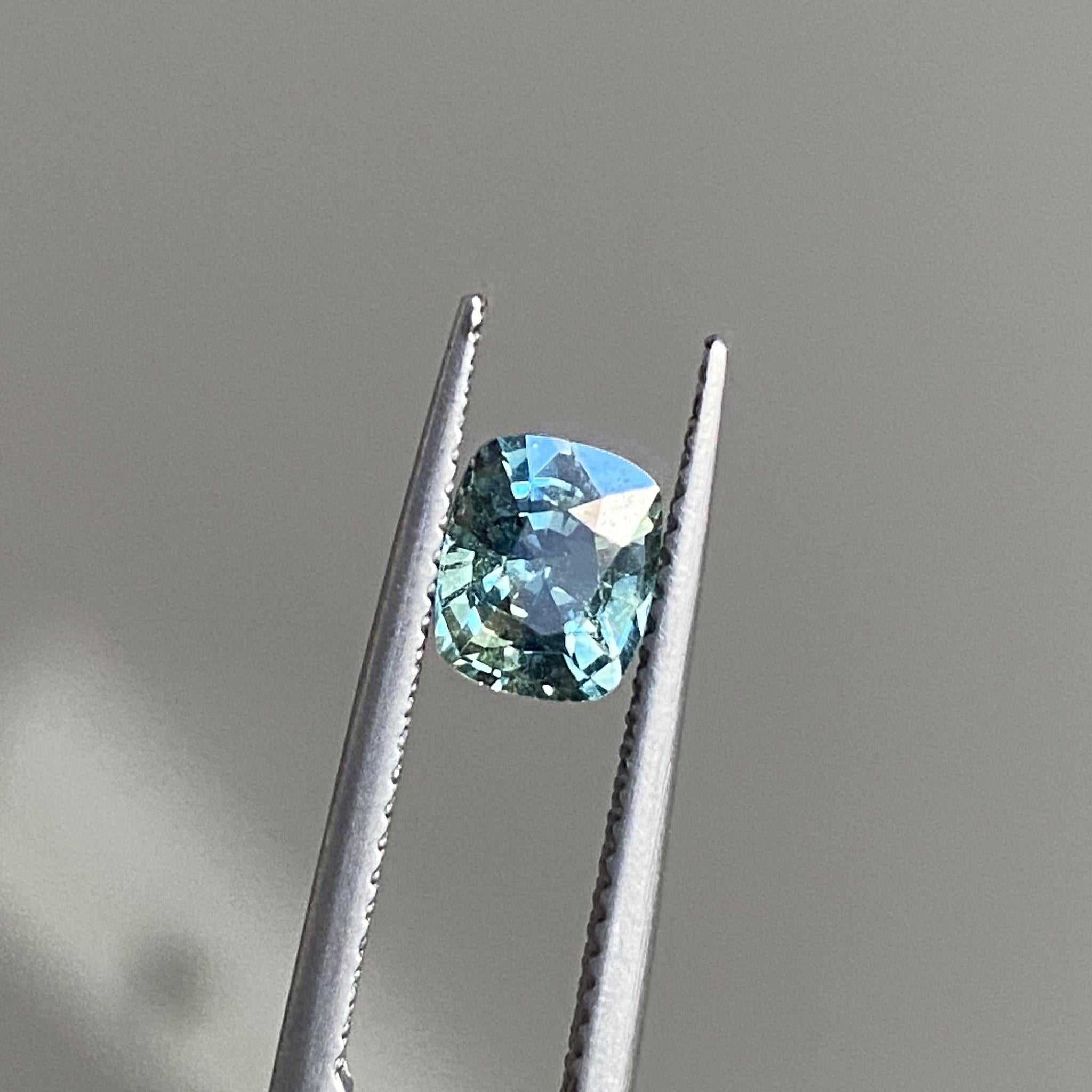 Mint Tea cushion-cut teal sapphire showcasing its serene colour