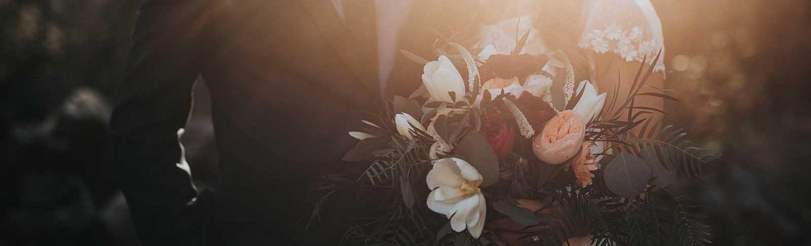 Wedding photo of a couple with flowers