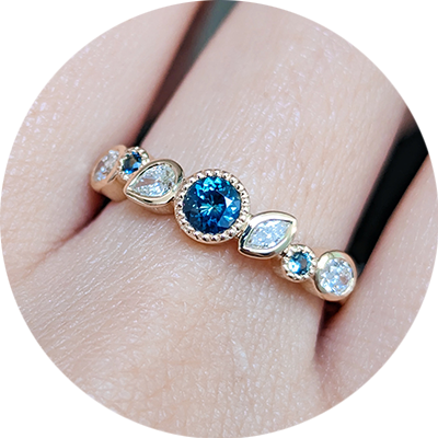 Nicole's diamond and sapphire gold wedding band