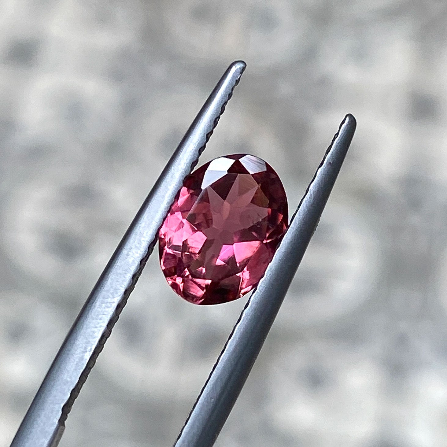 Orange pink bicolour tourmaline in an oval cut