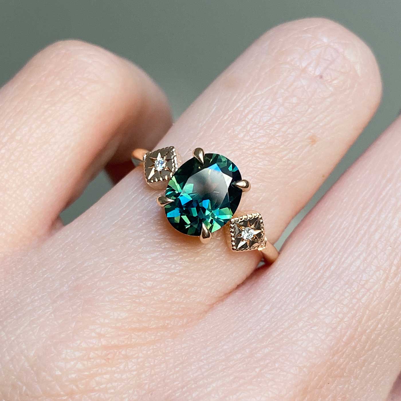 Ethical oval Australian teal sapphire engagement ring