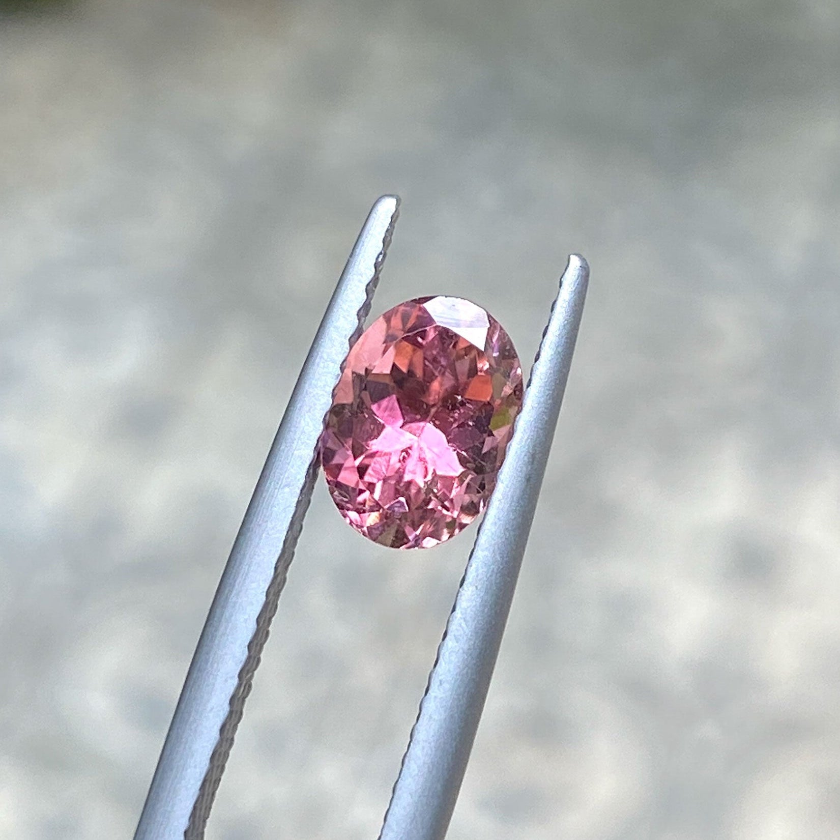 Oval peach and pink bicolour tourmaline