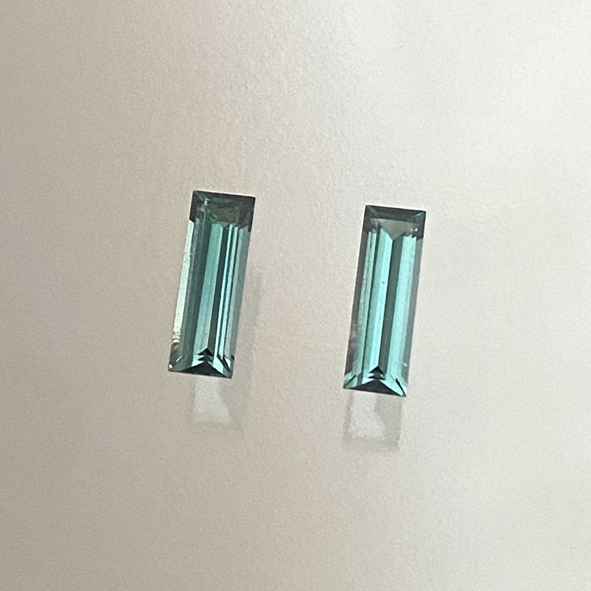 Pair of elongated baguette teal tourmalines