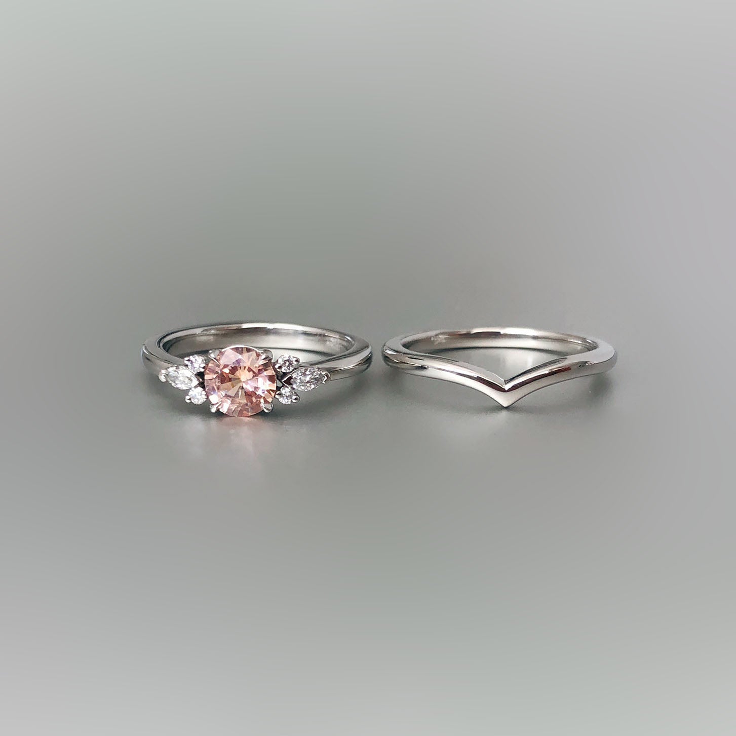 Peach sapphire and diamond engagemnet ring with fitted wedder