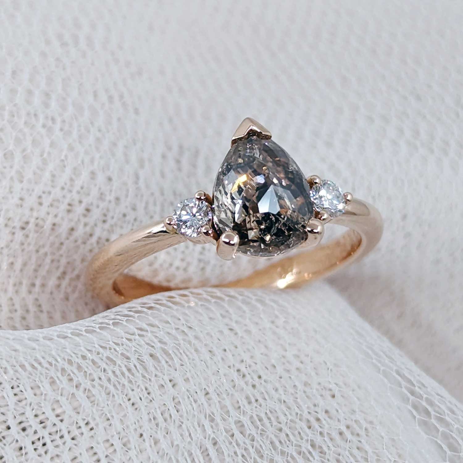 Pear salt and pepper diamond three-stone ring in rose gold