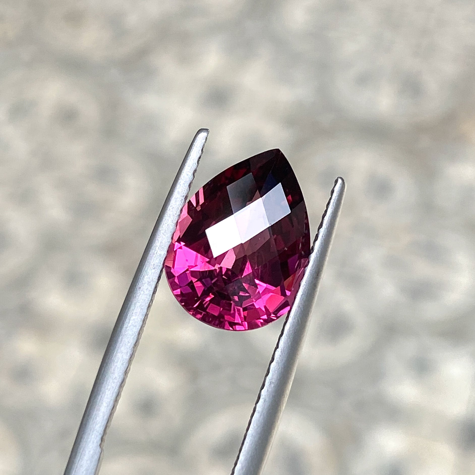 Deep burgundy garnet, pear shaped, checkerboard cut