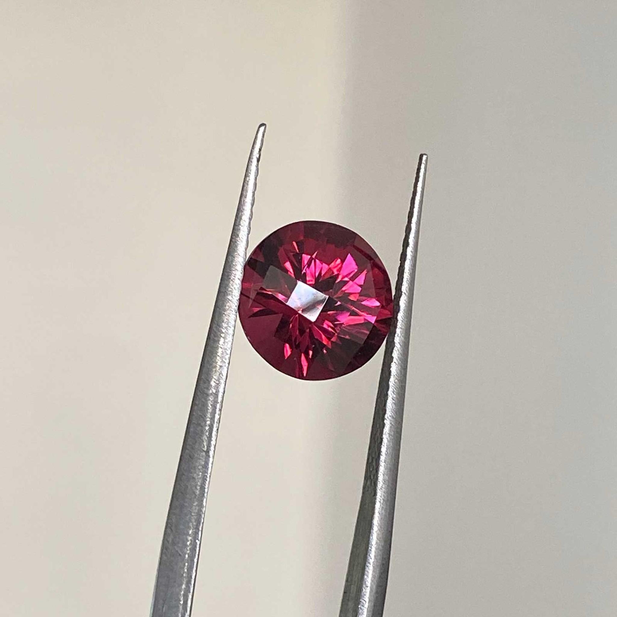 round rhodolite garnet gemstone closeup details