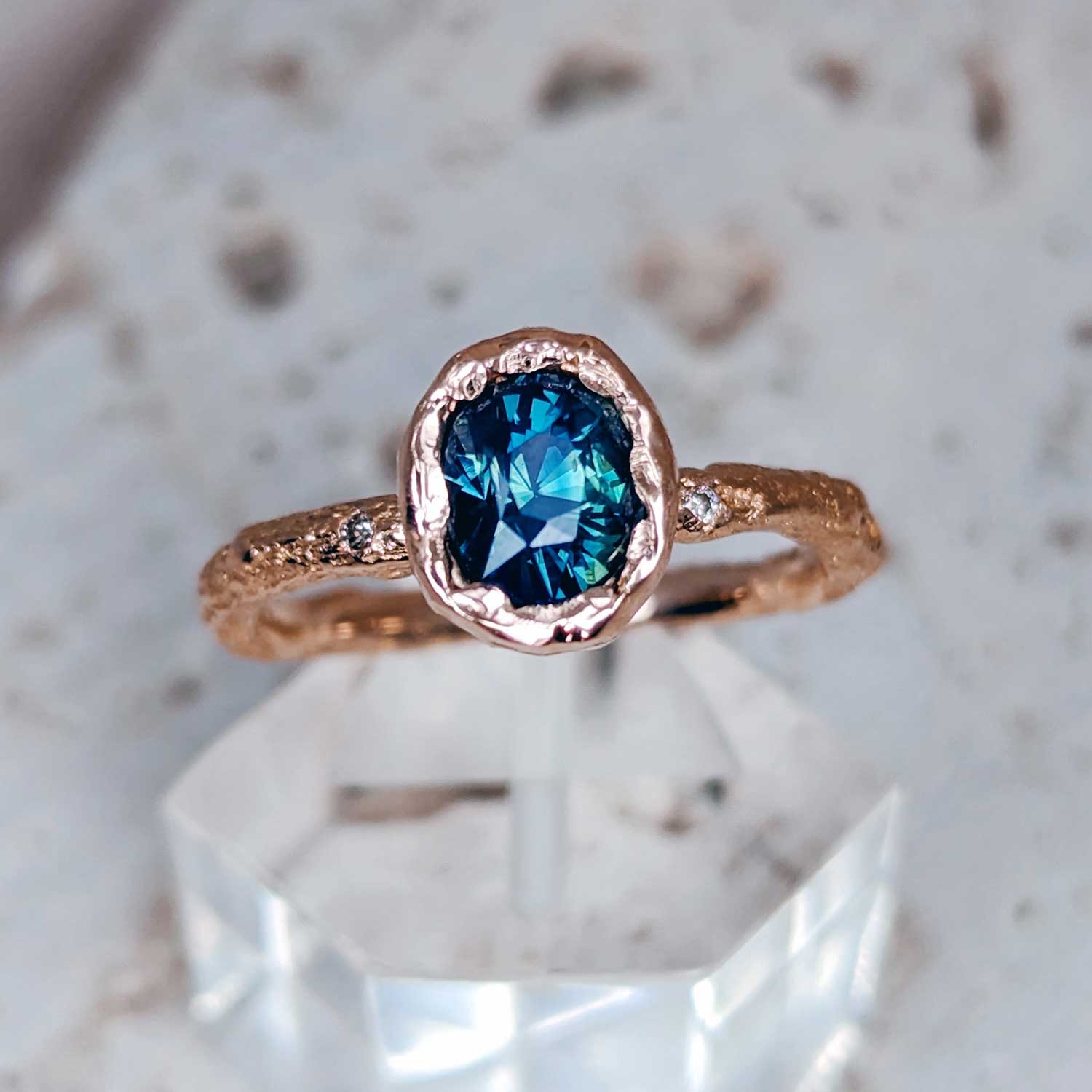 Teal oval sapphire and rose gold twig ring by Fairina Cheng