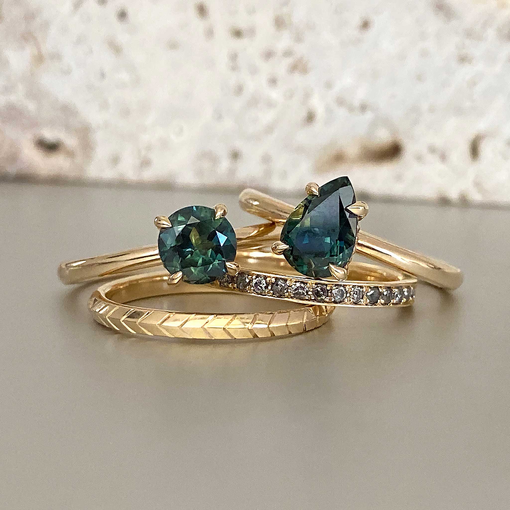 Teal sapphire stacking engagement and wedding rings