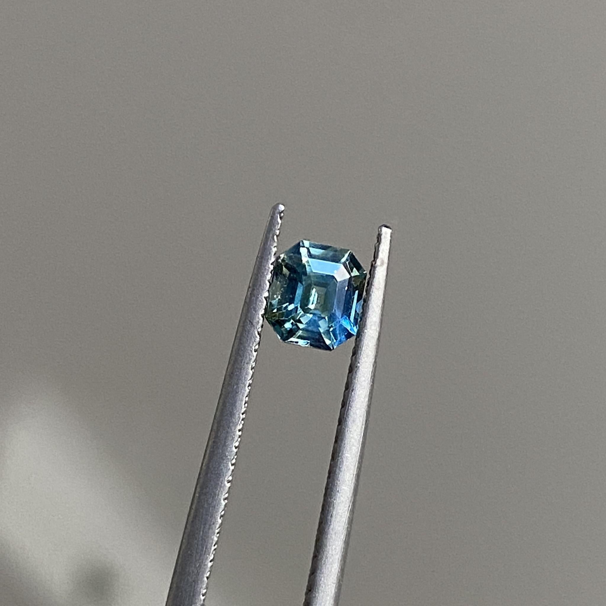 Reverie emerald-cut sapphire with its elegant interplay of teal and yellow