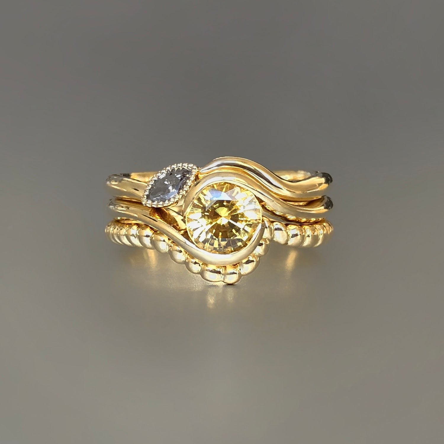 Yellow sapphire and marquis diamond stacking rings