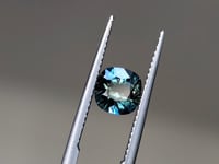 Cushion cut sapphire reflecting light