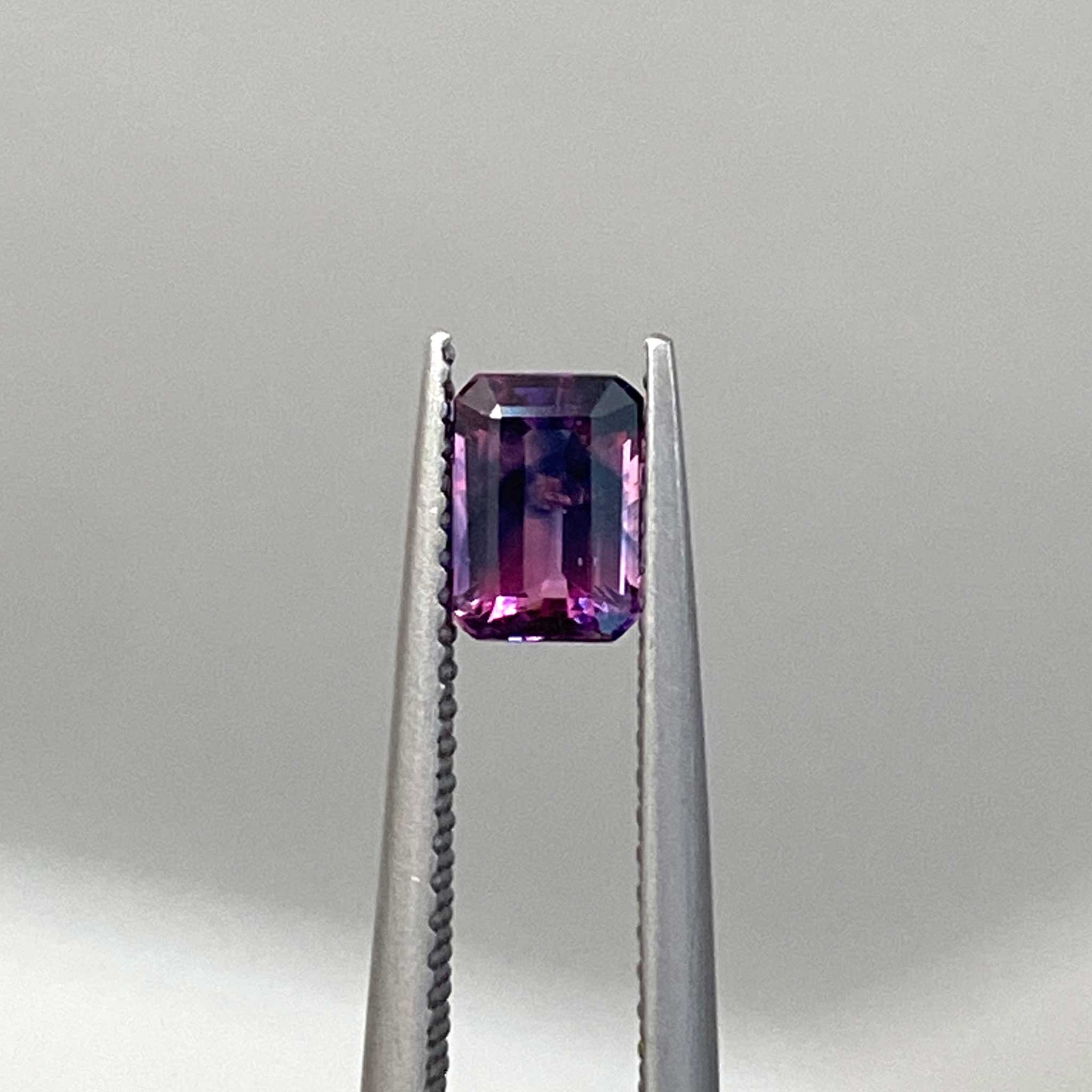 Emerald cut bicolour sapphire gemstone