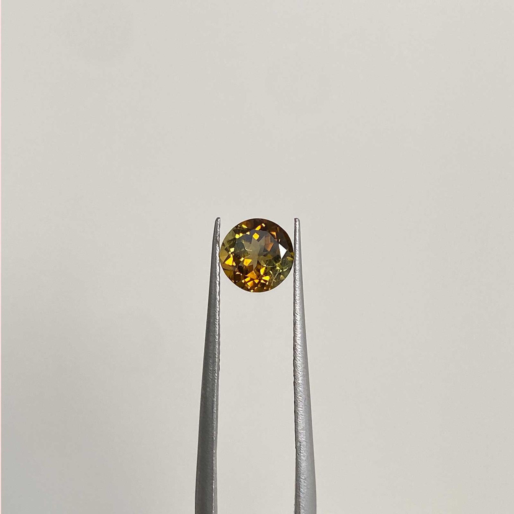 Sidecar cognac bicolour tourmaline gem displayed