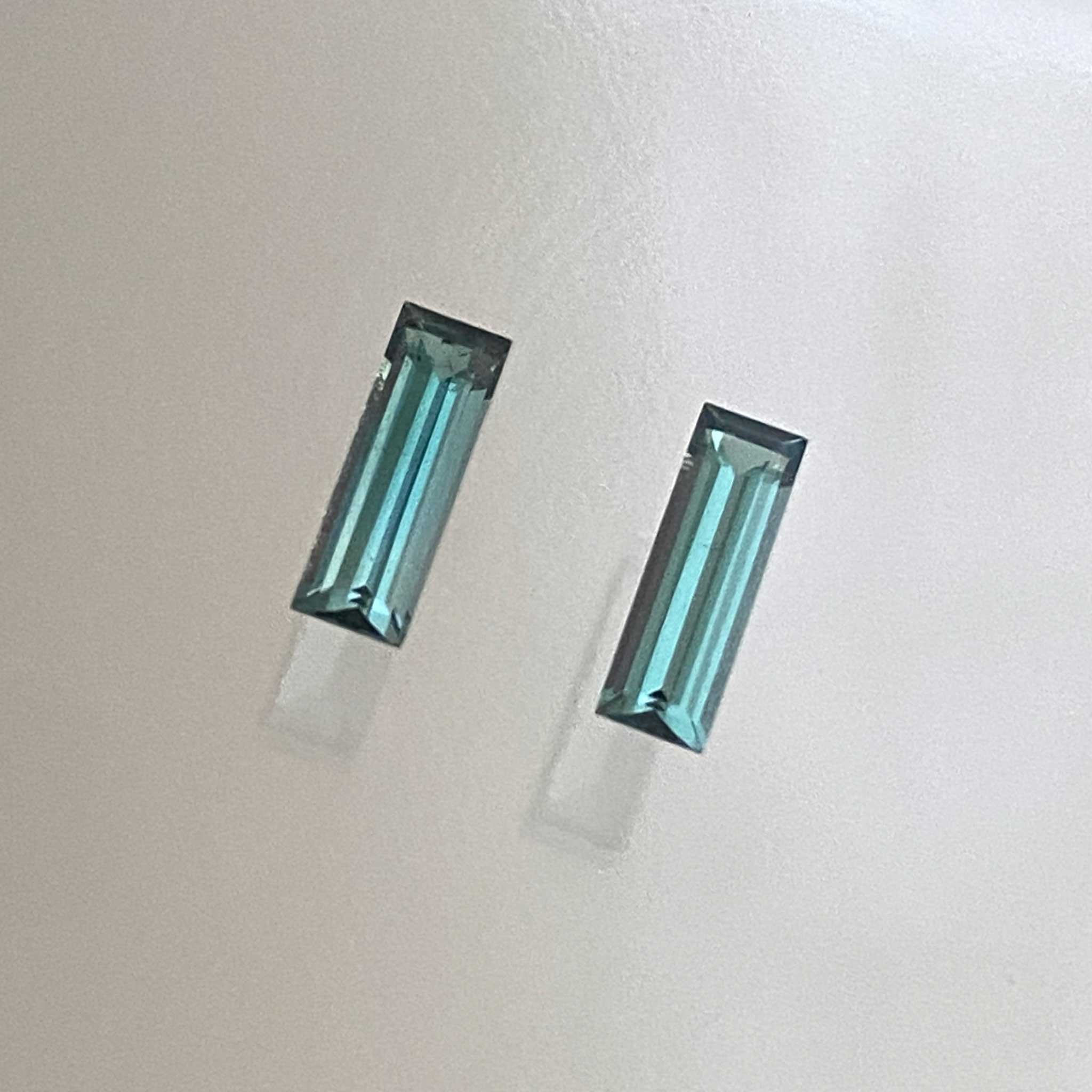 Vibrant teal elongated baguette tourmaline pair