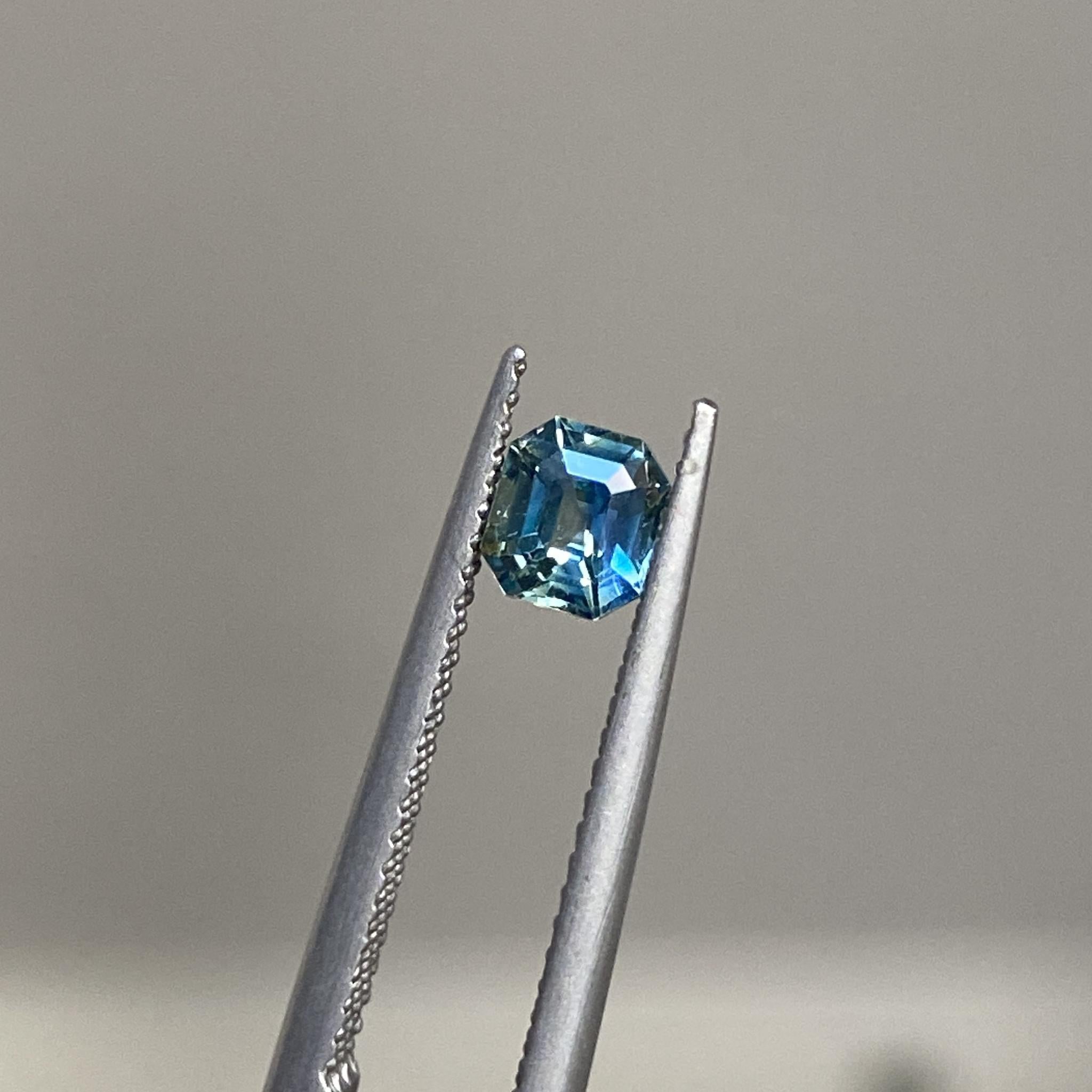 Reverie emerald-cut sapphire displaying its unique combination of teal and yellow hues