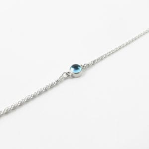 Blue topaz domed gemstone bracelet with a sterling silver rope chain