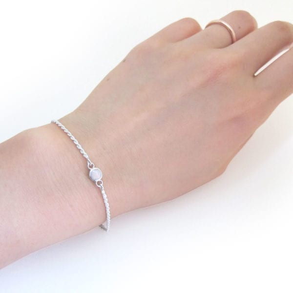 Dainty silver opal bracelet on wrist