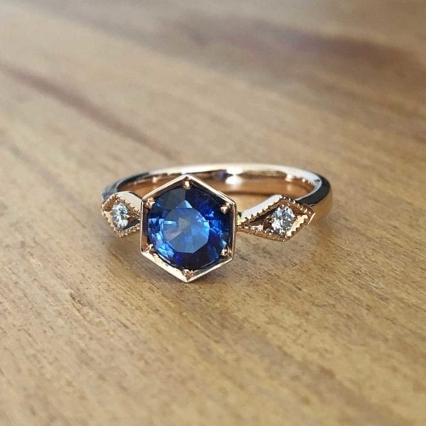 Unique blue sapphire engagement ring in a vintage Art Deco style