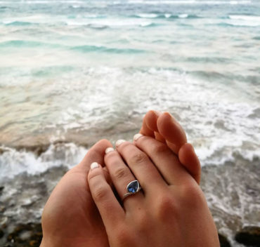 Sapphire ring in a beachside proposal