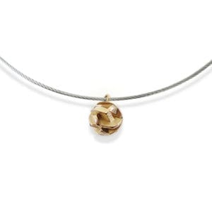 Yellow gold choker necklace on stainless steel cable
