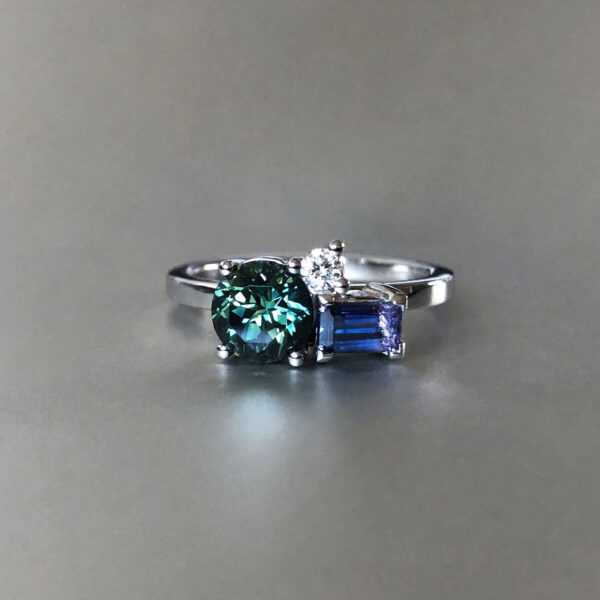 Green sapphire, Tanzanian sapphire and diamond ring in platinum