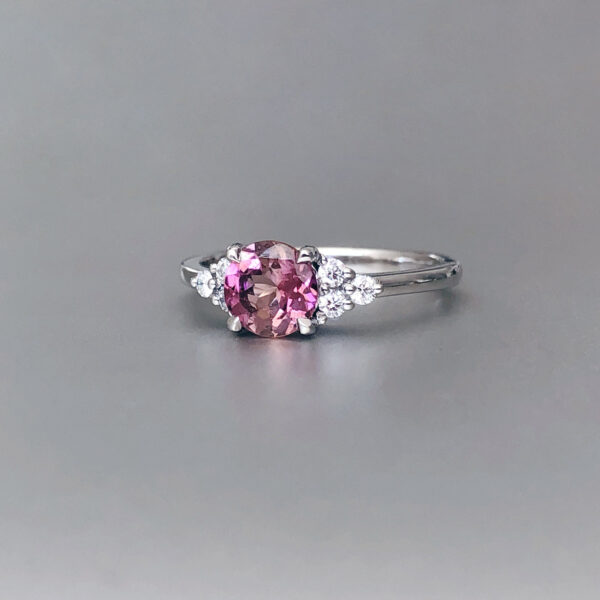 Pink tourmaline engagement ring with diamonds in platinum