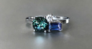 Green sapphire, Tanzanian sapphire and diamond ring in platinum