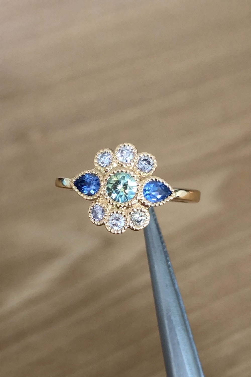Australian parti sapphire, Ceylon sapphire and diamond ring in recycled gold