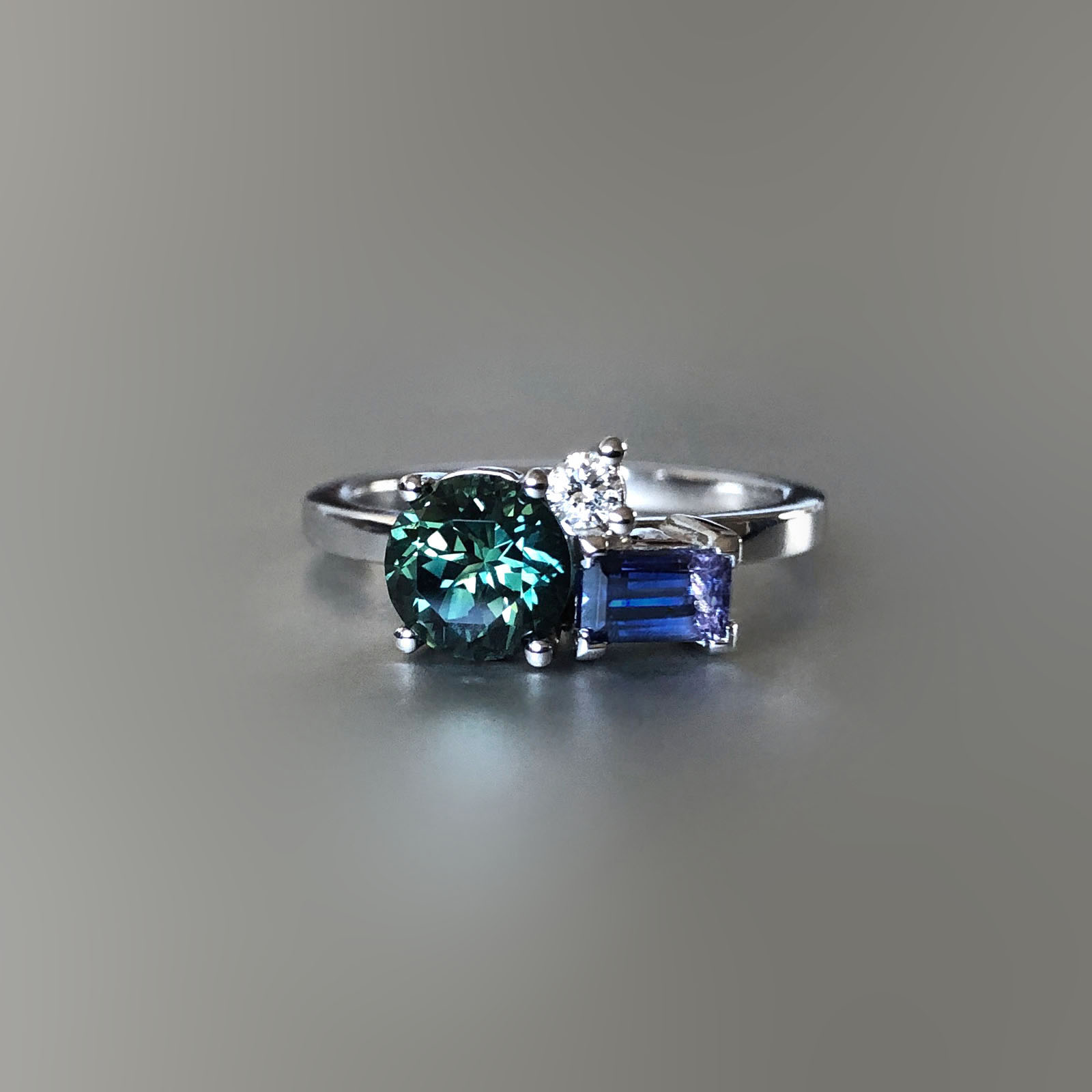 Platinum, Australian sapphire, Tanzanian sapphire and diamond ring